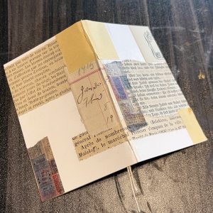 A partially decorated mini journal cover