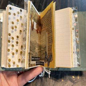 A mini junk journal in a pocket-size TN cover.