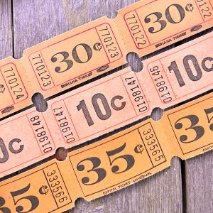 Three rows of orange carnival tickets
