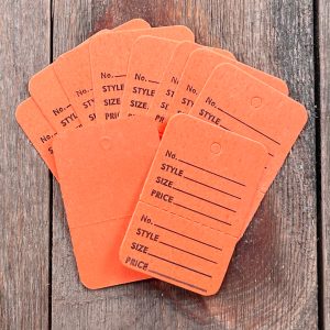 10 Small vintage orange clothing tags with text