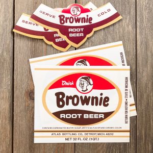Four assorted vintage Brownie Root Beer soda labels