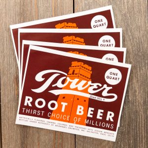 Four vintage brown Tower Root Beer soda labels featuring an orange tower illustration