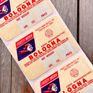 A strip of three Bologna price stickers featuring a boy in a hat and scarf