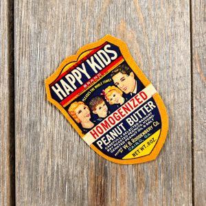One vintage Happy Kids peanut butter label from 1935, which features a cute family illustration