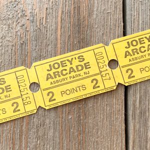 A strip of 3 vintage yellow Joey’s Arcade tickets for 2 Points
