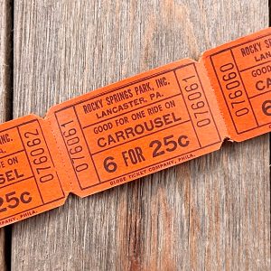 A strip of 3 vintage orange Rocky Springs Park Carrousel tickets