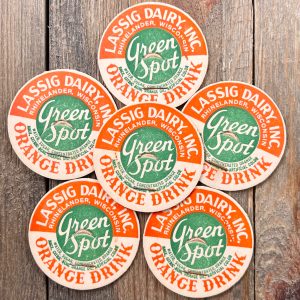 6 Vintage orange, green and white Lassig Dairy Green Spot Orange Drink cardboard caps