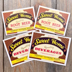4 Assorted vintage brown, red, black, yellow, and off white Sweet Home soda labels with gold accents