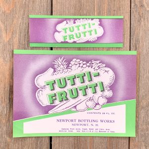 2 Different vintage vibrant purple, green, and white Tutti-Frutti soda labels