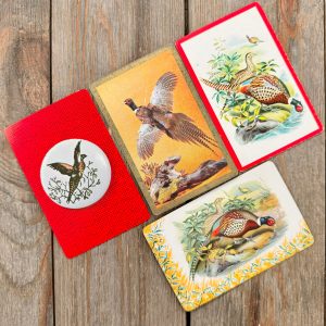 4 different vintage playing cards each featuring different pheasant illustrations