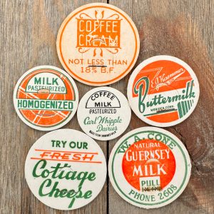 6 Different vintage orange, green & white milk caps in different sizes and styles