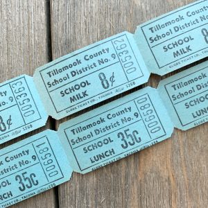 Two rows of vintage aqua blue school milk & school lunch tickets