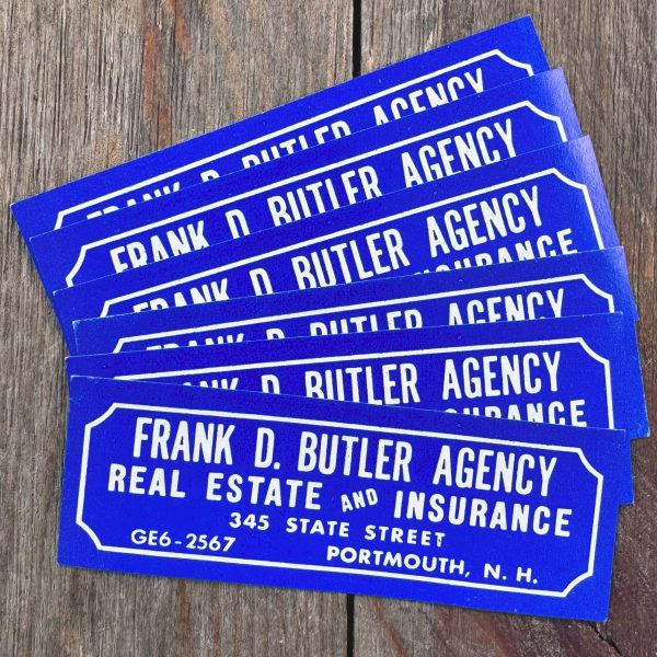 Six vintage bright blue Real Estate advertising labels with white text